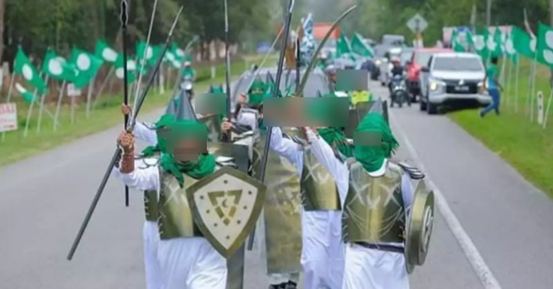 PAS Members March With Fake Weapons